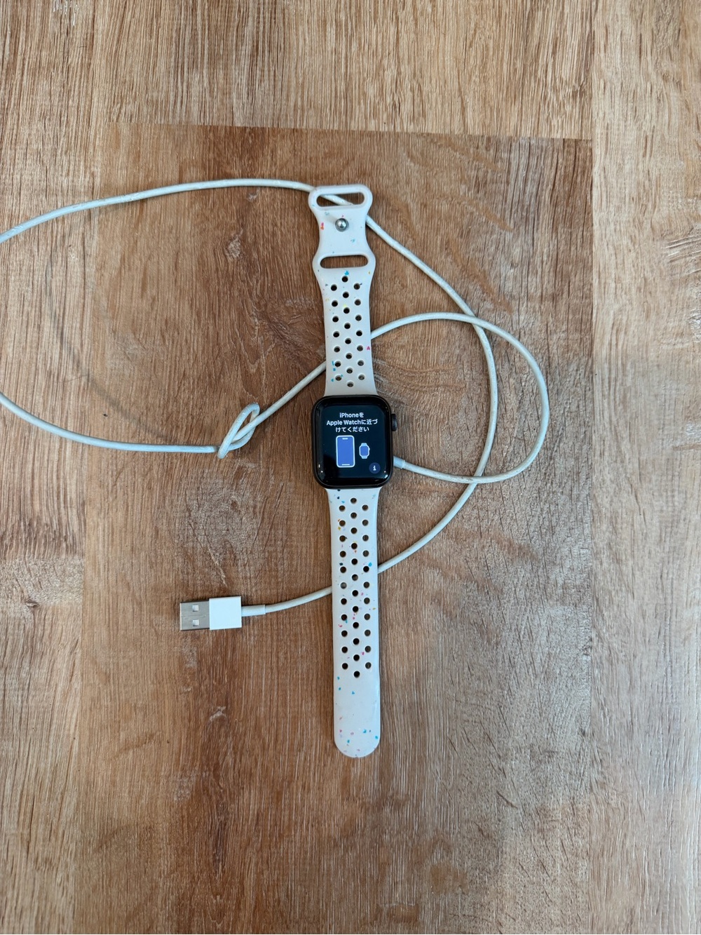 Apple Watch with White Speckled Sport Band and Charging Cable - Picture 1 of 3